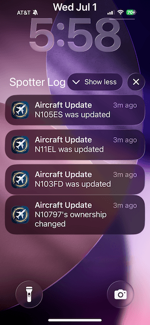 iPhone lock screen with SpotterLog aircraft update notifications for followed tail numbers