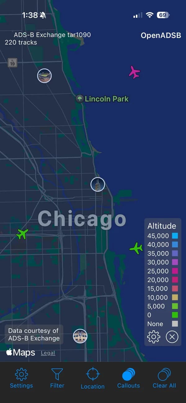 OpenADSB (ADS-B Exchange) showing live tracks over Chicago with an altitude legend.